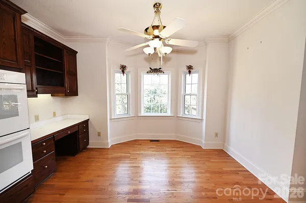 a view of entryway kitchen and wooden floor