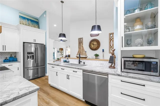 a living room with furniture a rug and a table