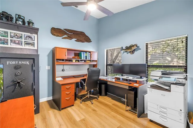 a workspace with furniture and wooden floor