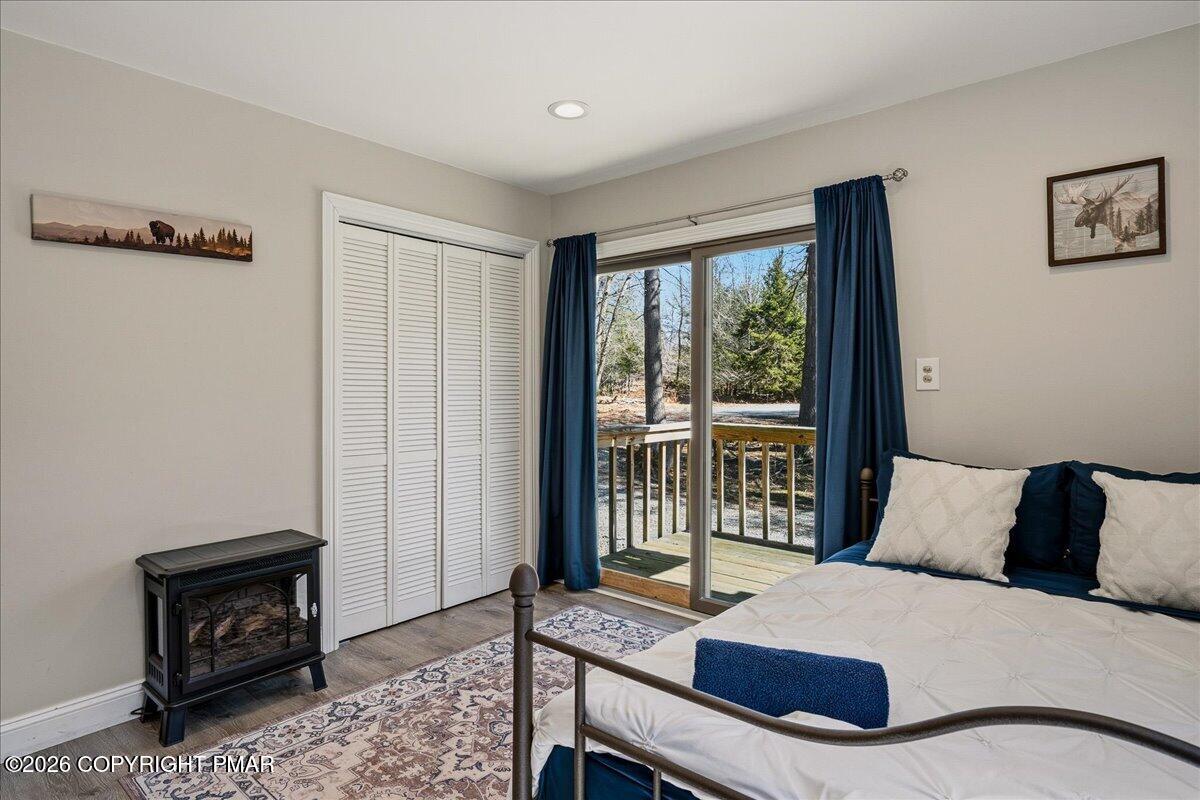 369 Sidney Avenue Pocono Summit, PA 18346 - Photo 17 of 32 a bedroom with a bed and a tv