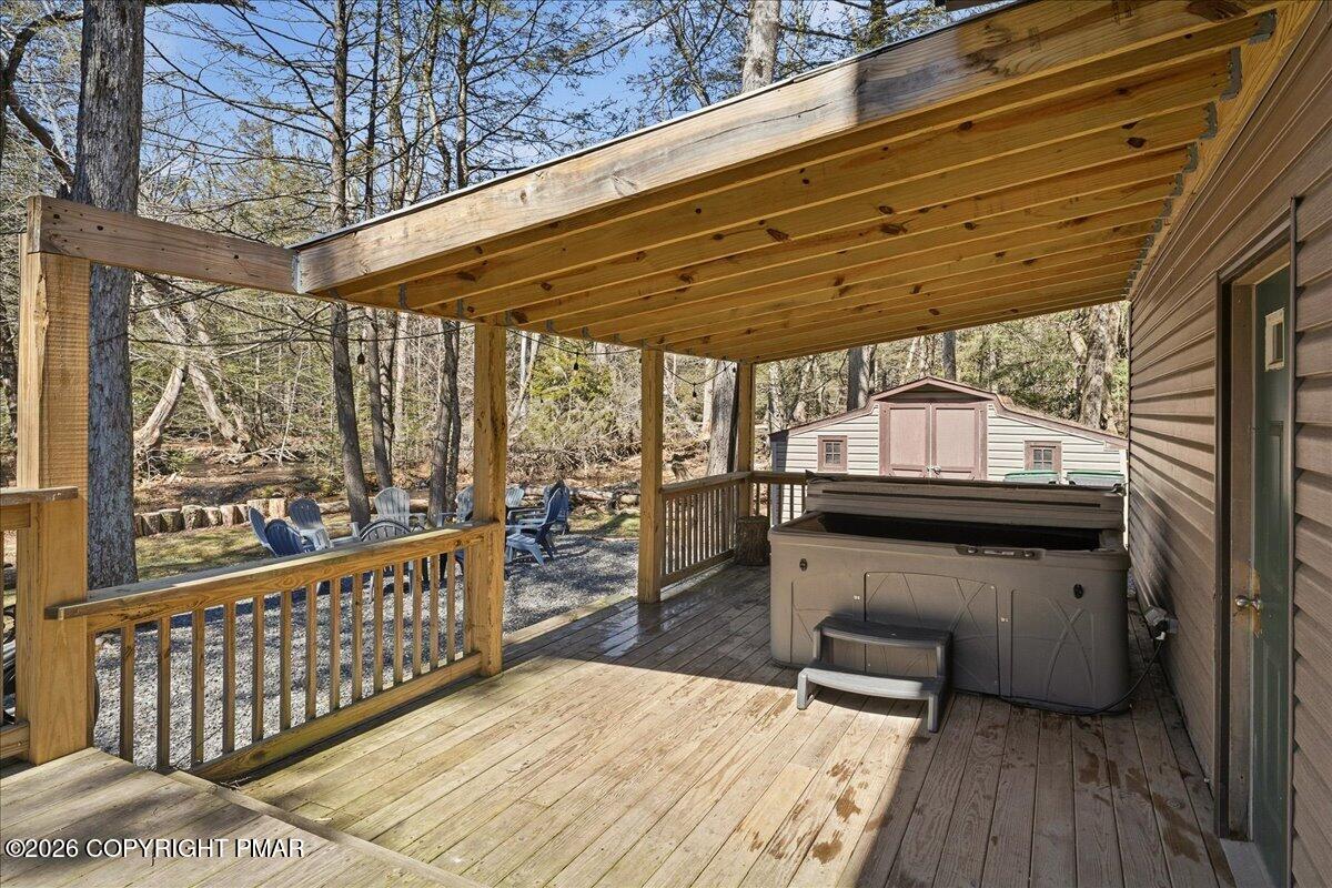 369 Sidney Avenue Pocono Summit, PA 18346 - Photo 25 of 32 a balcony with an outdoor seating