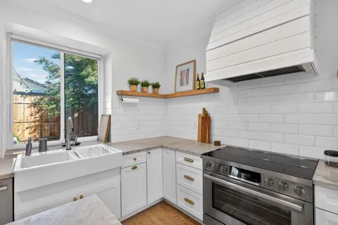 a kitchen with a stove and a sink