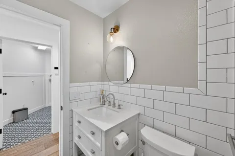 a bathroom with a sink toilet and vanity