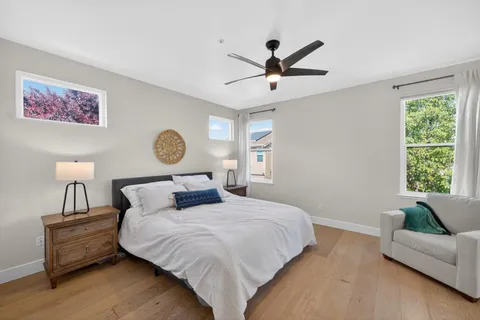 a bedroom with a large bed and a window