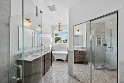 a bathroom with a double vanity sink and mirror