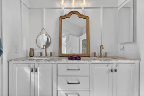 a bathroom with a bath tub with a shower
