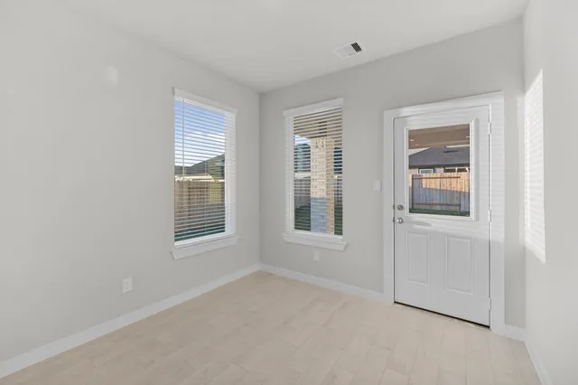 a view of an empty room with a window