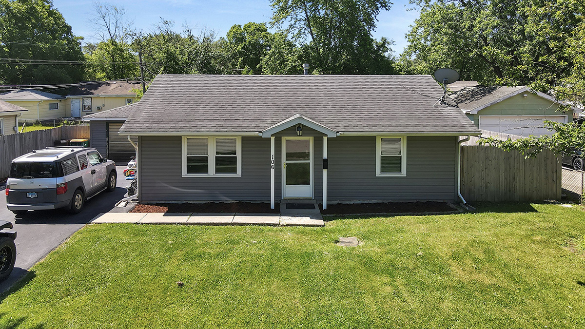 106 Louis Road Joliet, IL 60433 - Photo 1 of 14 a house view with a garden space