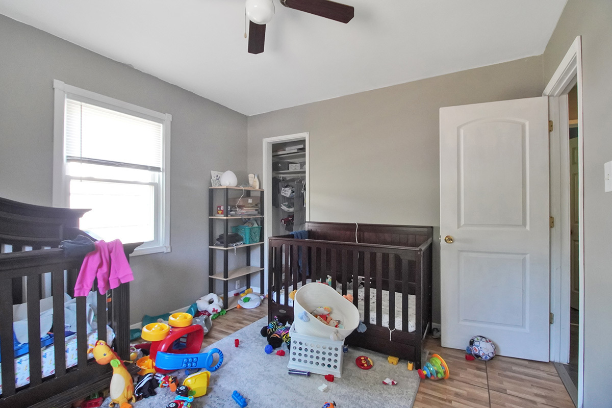 106 Louis Road Joliet, IL 60433 - Photo 11 of 14 a bedroom with furniture a couch and a window