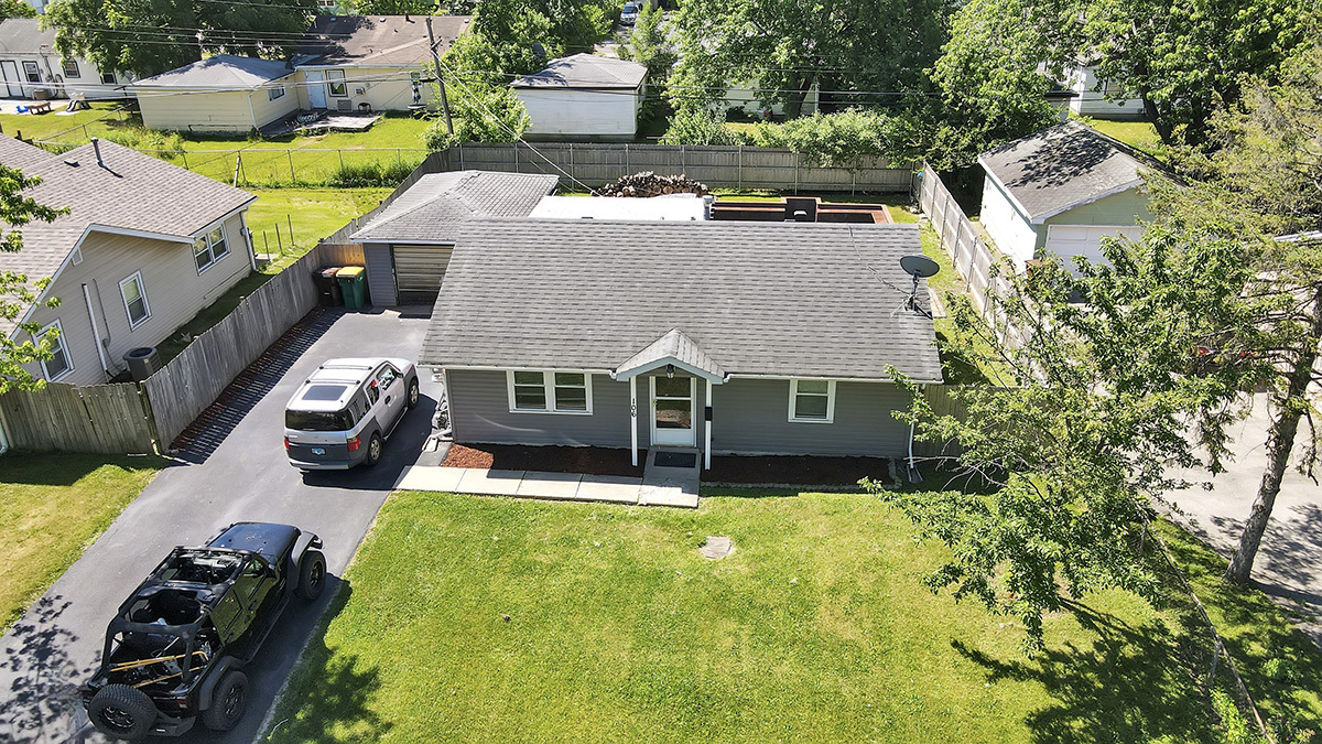 106 Louis Road Joliet, IL 60433 - Photo 2 of 14 an aerial view of a house with swimming pool garden and patio
