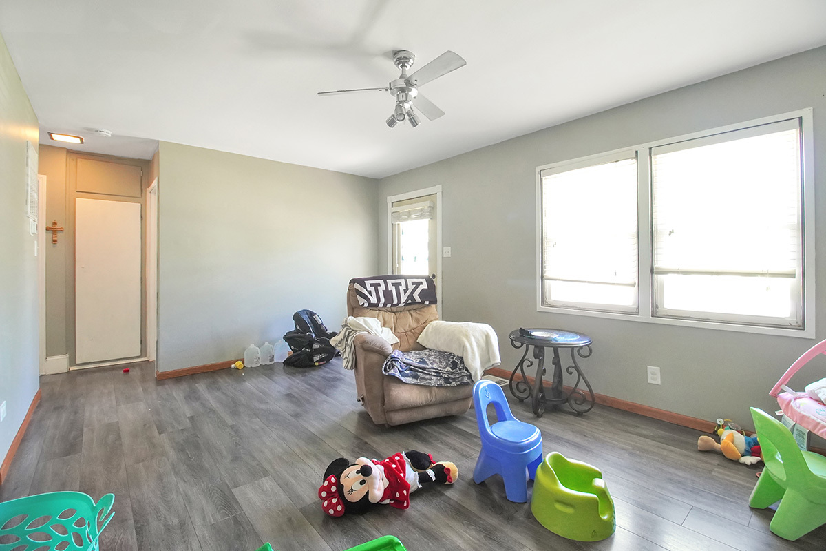 106 Louis Road Joliet, IL 60433 - Photo 3 of 14 a living room with furniture and wooden floor
