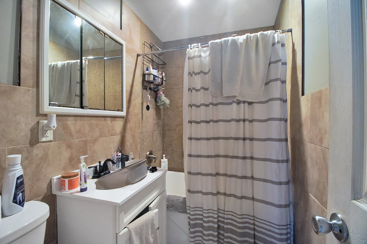 106 Louis Road Joliet, IL 60433 - Photo 9 of 14 a bathroom with a sink and mirror