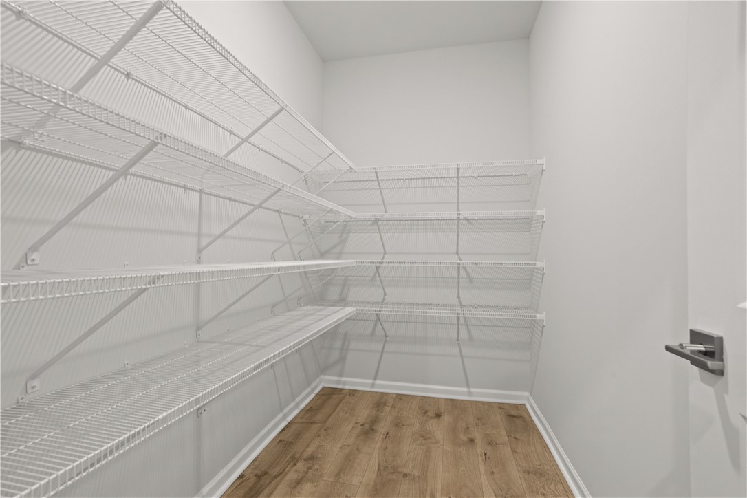 629 Sweetspire Trail, Unit 149 Seneca, SC 29678 - Photo 8 of 30 Maximise storage potential in this well-organized walk-in closet, featuring extensive wire shelving.