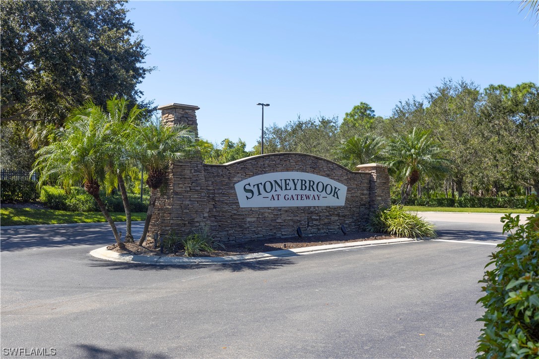12956 Stone Tower Loop Fort Myers, FL 33913 - Photo 21 of 26 a sign board with a play ground in the back