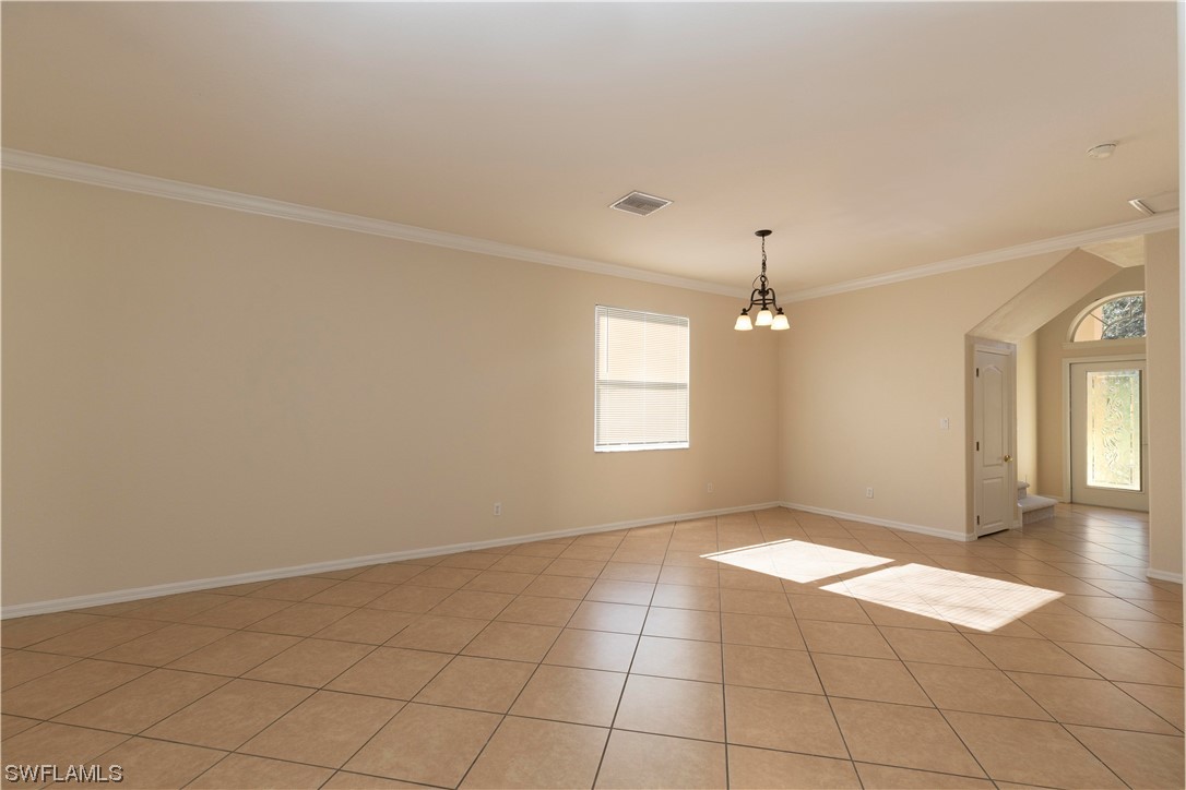12956 Stone Tower Loop Fort Myers, FL 33913 - Photo 6 of 26 an empty room with windows and fan
