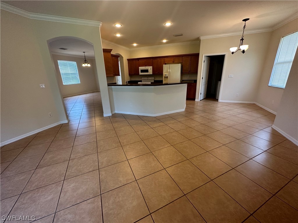 12956 Stone Tower Loop Fort Myers, FL 33913 - Photo 7 of 26 a view of a kitchen with a sink and a microwave