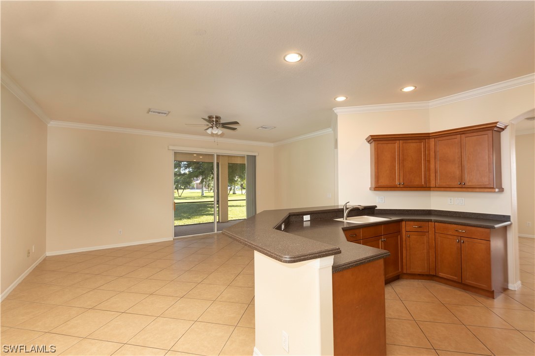 12956 Stone Tower Loop Fort Myers, FL 33913 - Photo 8 of 26 a kitchen with a sink and cabinets