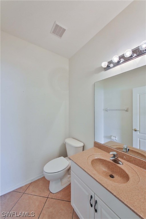12956 Stone Tower Loop Fort Myers, FL 33913 - Photo 10 of 26 a bathroom with a granite countertop sink a toilet and a mirror