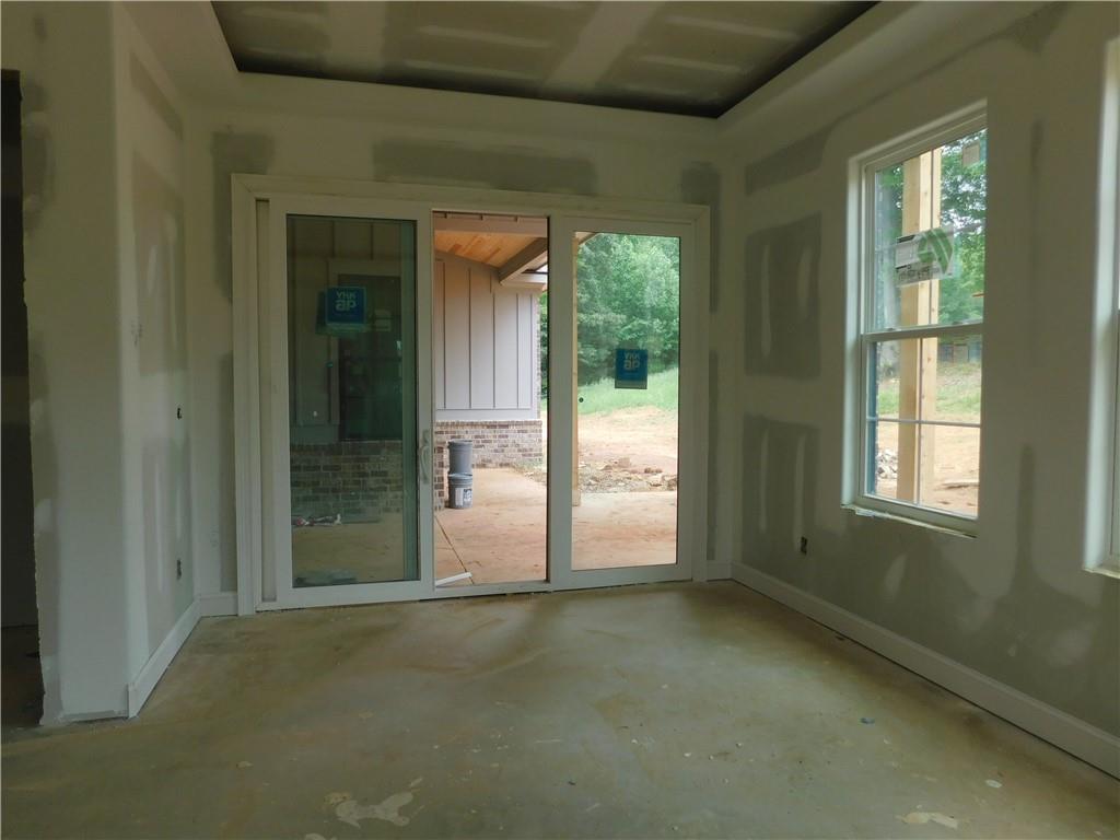 1652 Red Cedar Road Commerce, GA 30530 - Photo 6 of 9 an empty room that has a window