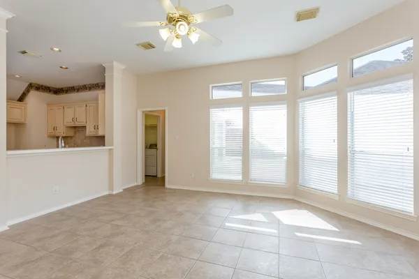 a large kitchen with cabinets and stainless steel appliances