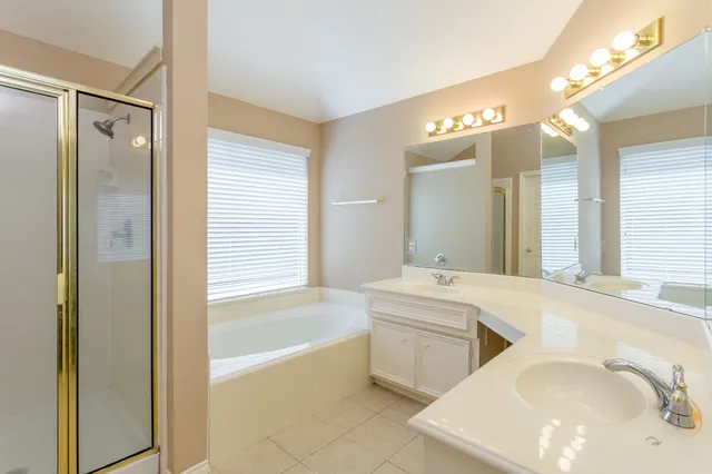 a bathroom with a bathtub and a shower