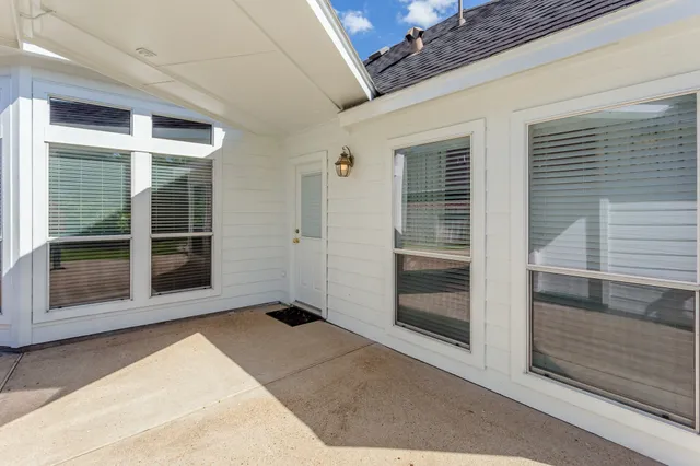 a view of an house with backyard space and garden