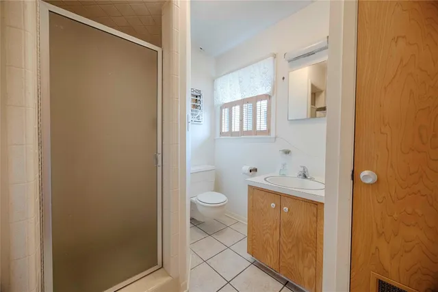 a bathroom with a toilet a sink and bath tub