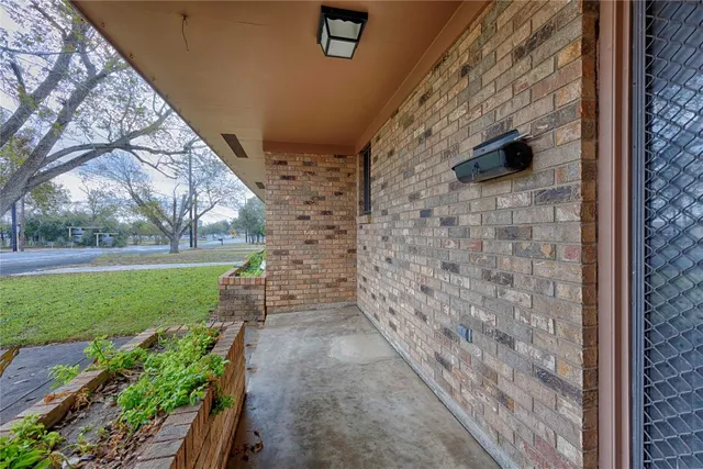 a view of a pathway both side of house with yard