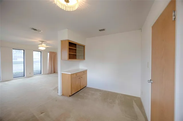 a view of an empty room with a fireplace