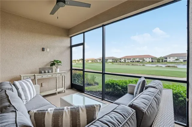 a living room with furniture and windows