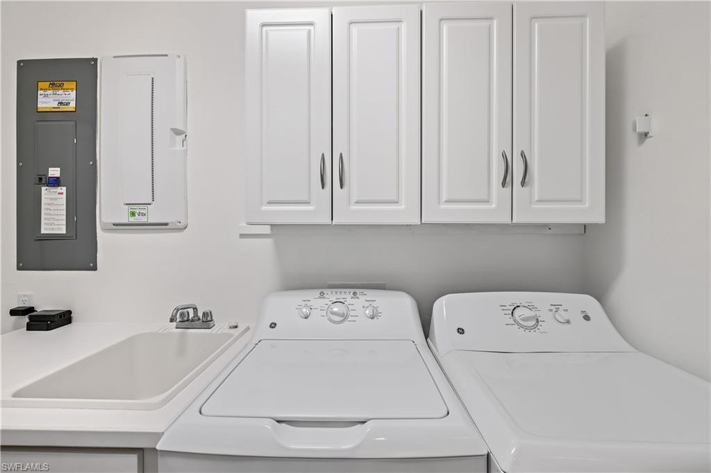 9374 Pocida Court, Unit 101 Naples, FL 34119 - Photo 32 of 32 a white bath tub sitting next to a white sink