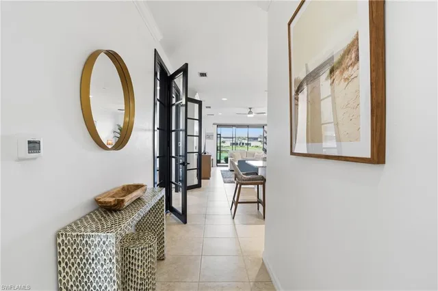 a view of entryway and hall with wooden floor