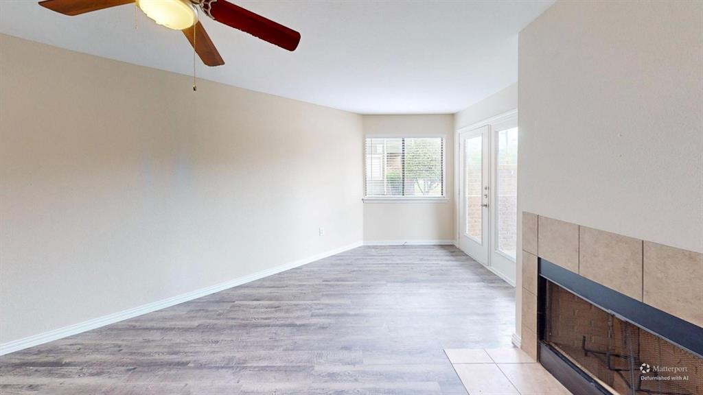 9837 Walnut Street, Unit 103 Dallas, TX 75243 - Photo 5 of 10 a view of an empty room with a window