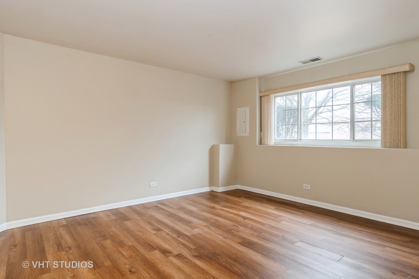 3499 Ravinia Circle Aurora, IL 60504 - Photo 16 of 20 an empty room with wooden floor and windows