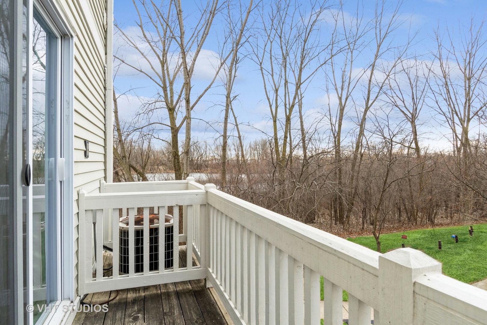 3499 Ravinia Circle Aurora, IL 60504 - Photo 17 of 20 a view of a wooden house with a small yard