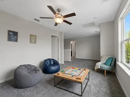 a living room with furniture and a window