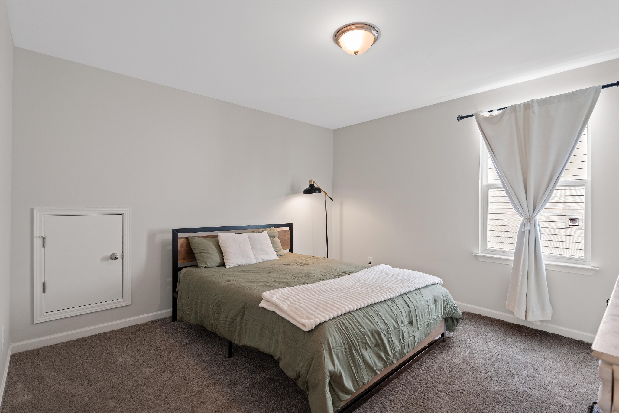 616 Castle Road Mount Juliet, TN 37122 - Photo 18 of 27 a bedroom with a bed and a window