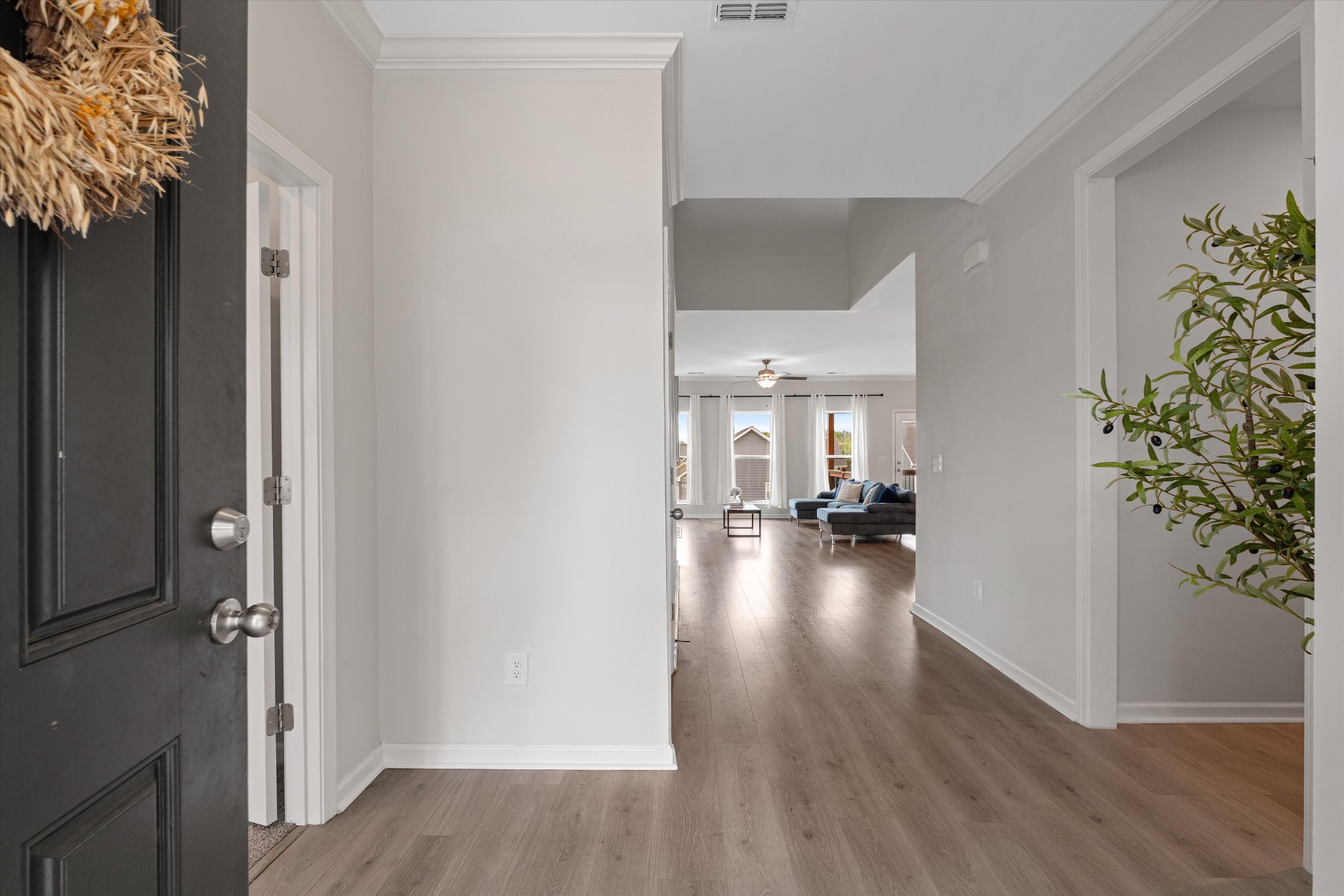 616 Castle Road Mount Juliet, TN 37122 - Photo 2 of 27 a view of a hallway view with wooden floor and living room