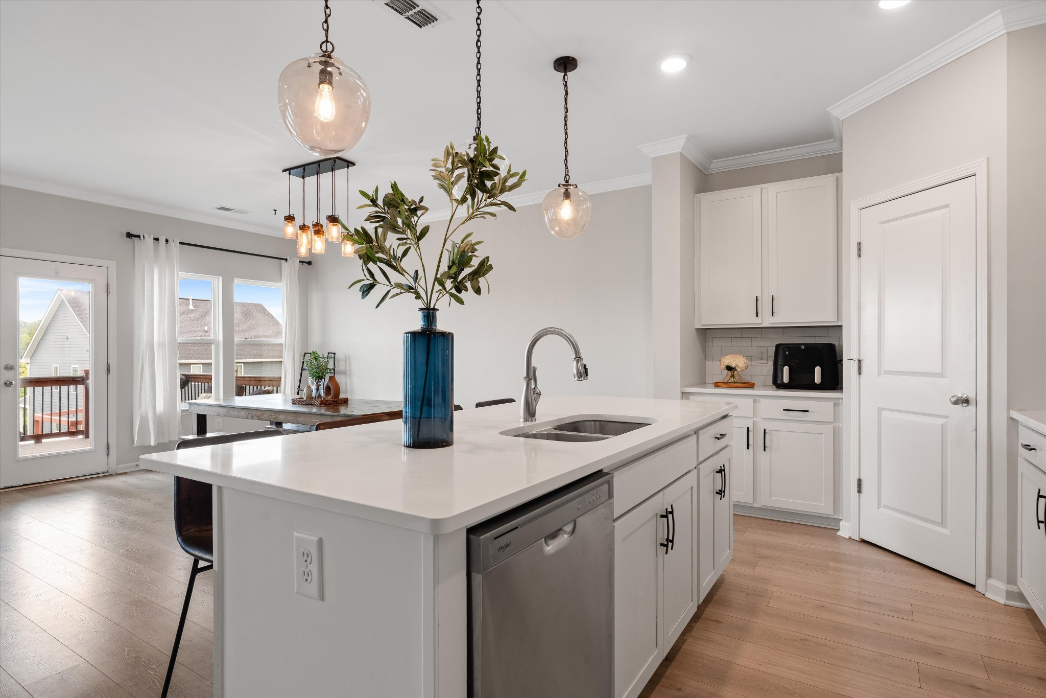 616 Castle Road Mount Juliet, TN 37122 - Photo 9 of 27 a kitchen with white cabinets and chandelier