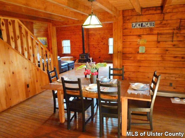 196 Rochester Center Road Accord, NY 12404 - Photo 8 of 31 a view of a dining room with furniture and wooden floor