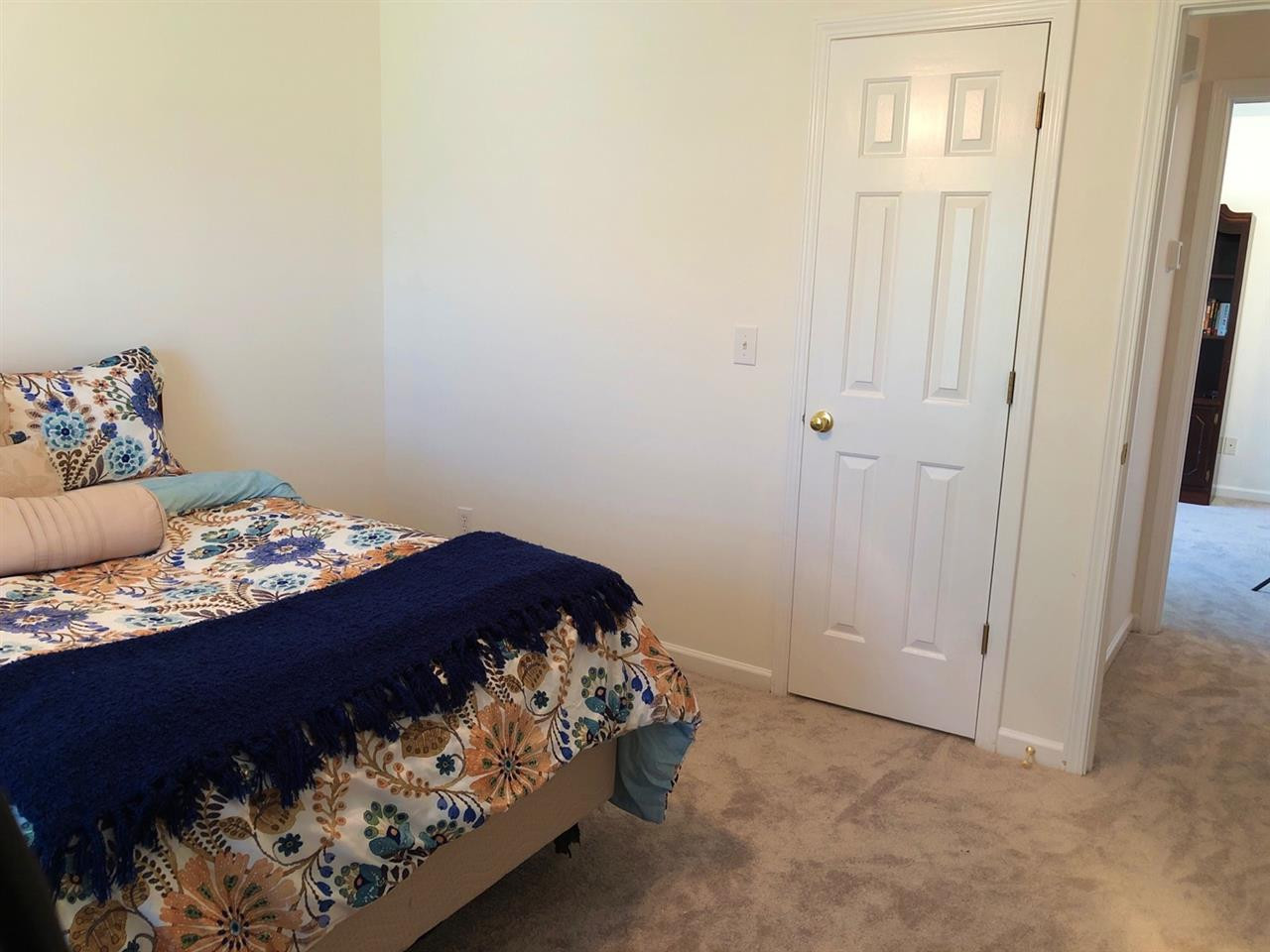 5400 Glass Ridge Road Raleigh, NC 27616 - Photo 27 of 30 2 of the 3 2nd floor bedrooms feature a walk in closet for extra storage. Guest Bedroom
