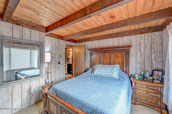 a bedroom with a bed and a walk in closet