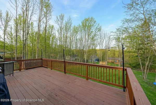 a view of a balcony with trees