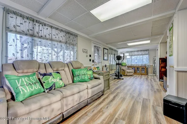 a room with furniture and view of bedroom