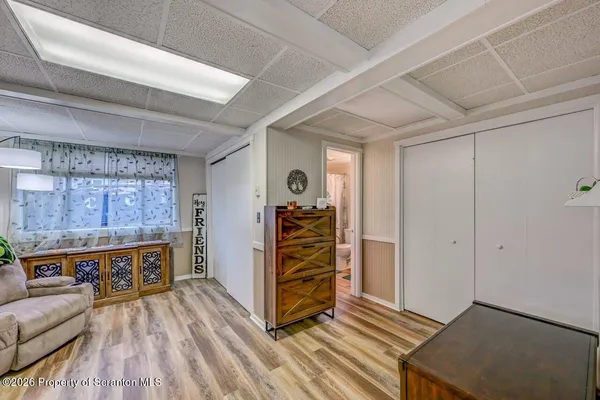 a bathroom with a toilet a sink and a window