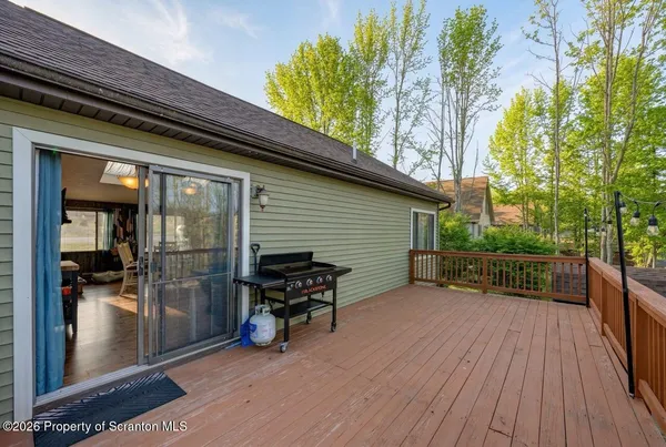 a view of a house with a yard and furniture
