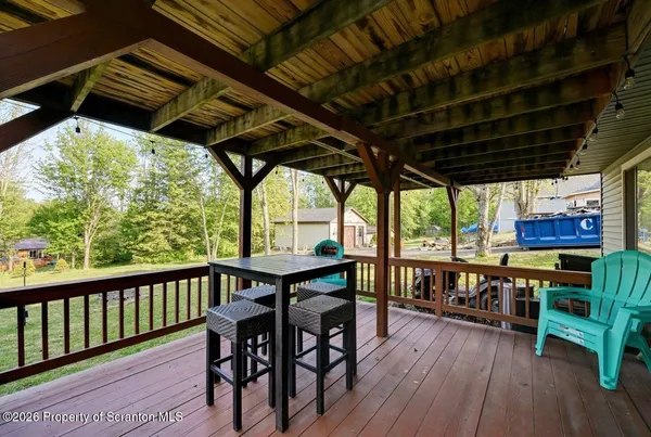 a view of a house with backyard and porch