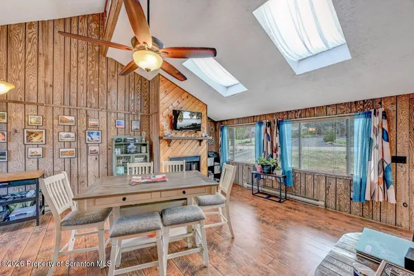 a living room filled with furniture and a window