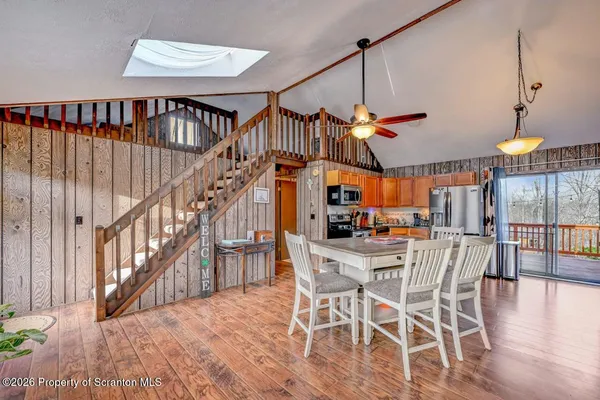 a view of a dining room with furniture window and entryway