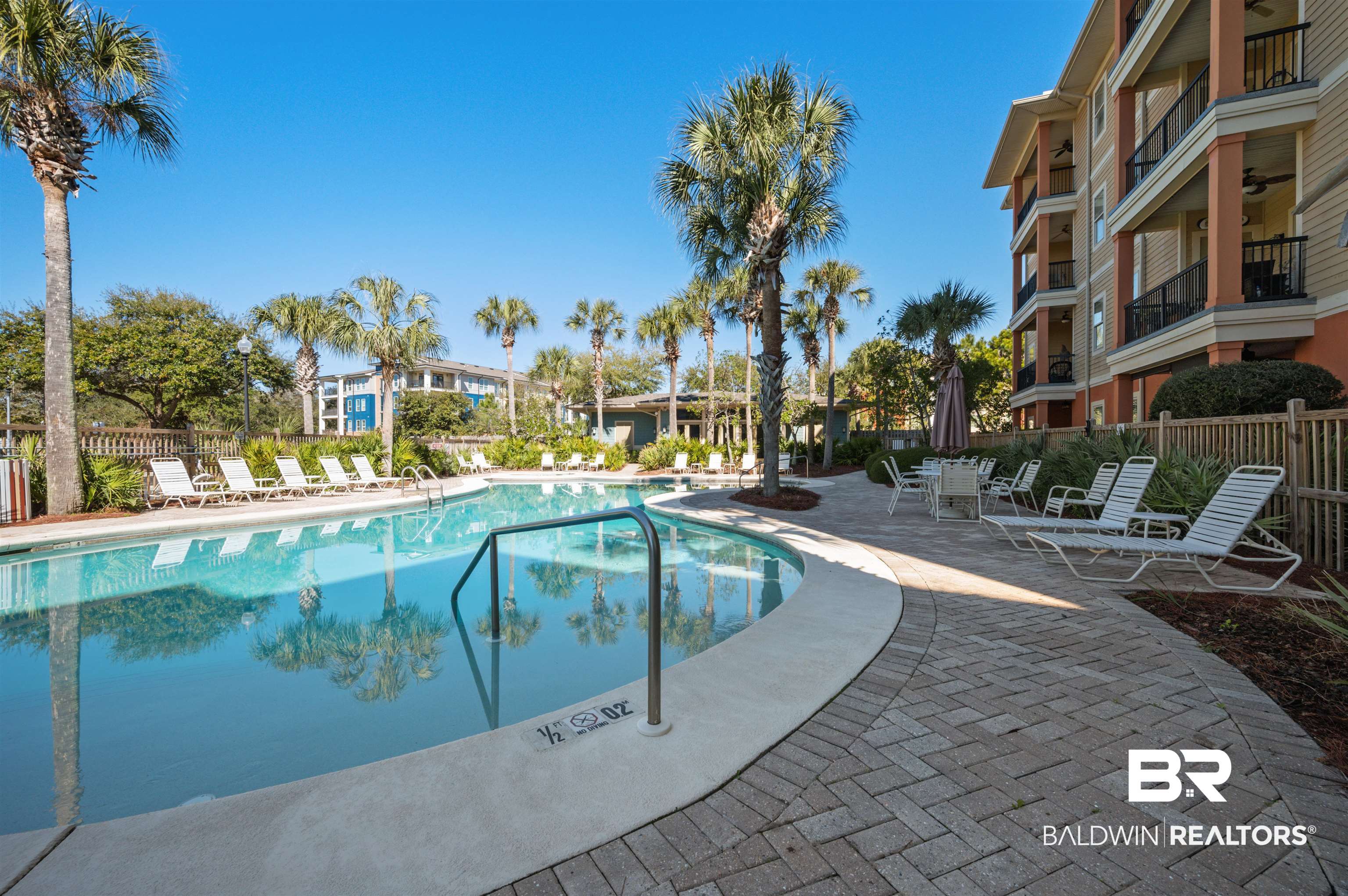 1430 Regency Road, Unit B202 Gulf Shores, AL 36542 - Photo 30 of 33 View of swimming pool with fence and a patio
